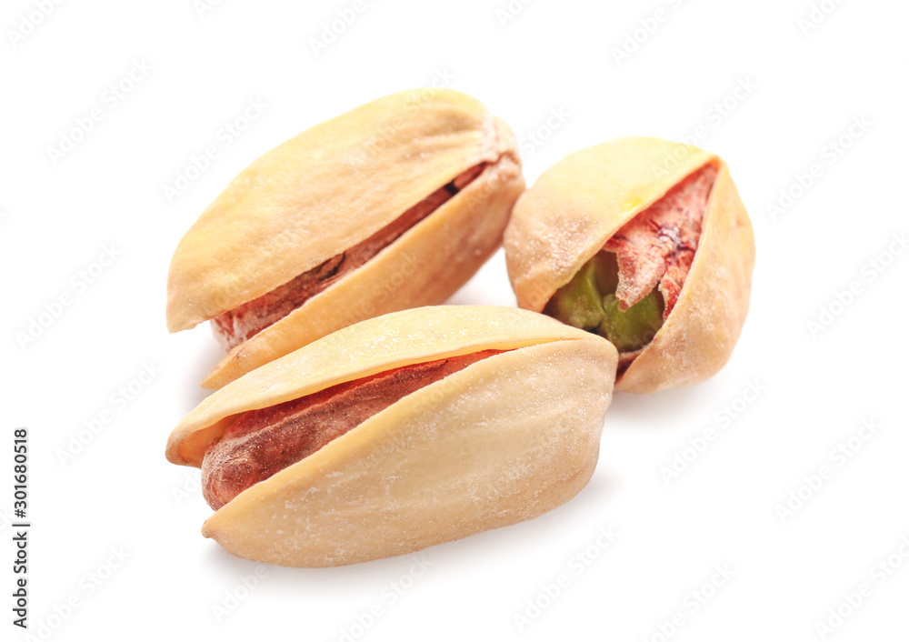 Tasty pistachio nuts isolated on white Tasty pistachio nuts isolated on white