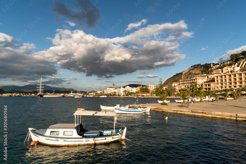 Late afternoon light on the Nafplion waterfront promenade and harbor in the Peloponnese in Greece