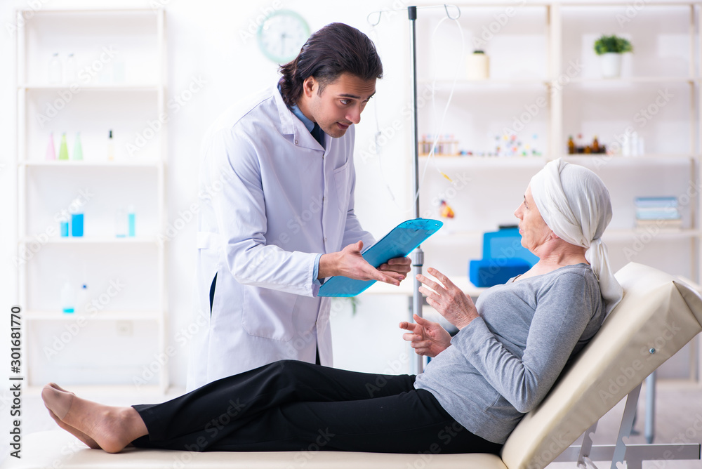 Young male doctor and female oncology patient Young male doctor and female oncology patient