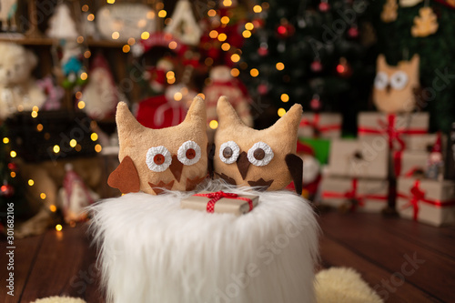 Christmas scene with beautiful bokeh in the background and plush owls