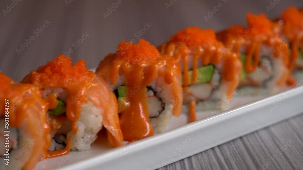 salmon sushi roll with sauce - Japanese food style salmon sushi roll with sauce - Japanese food style