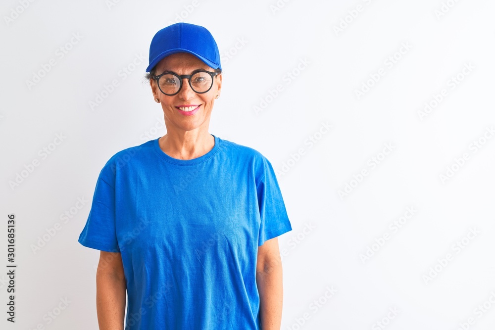 Senior deliverywoman wearing cap and glasses standing over isolated white background with a happy and cool smile on face. Lucky person. Senior deliverywoman wearing cap and glasses standing over isolated white background with a happy and cool smile on face. Lucky person.