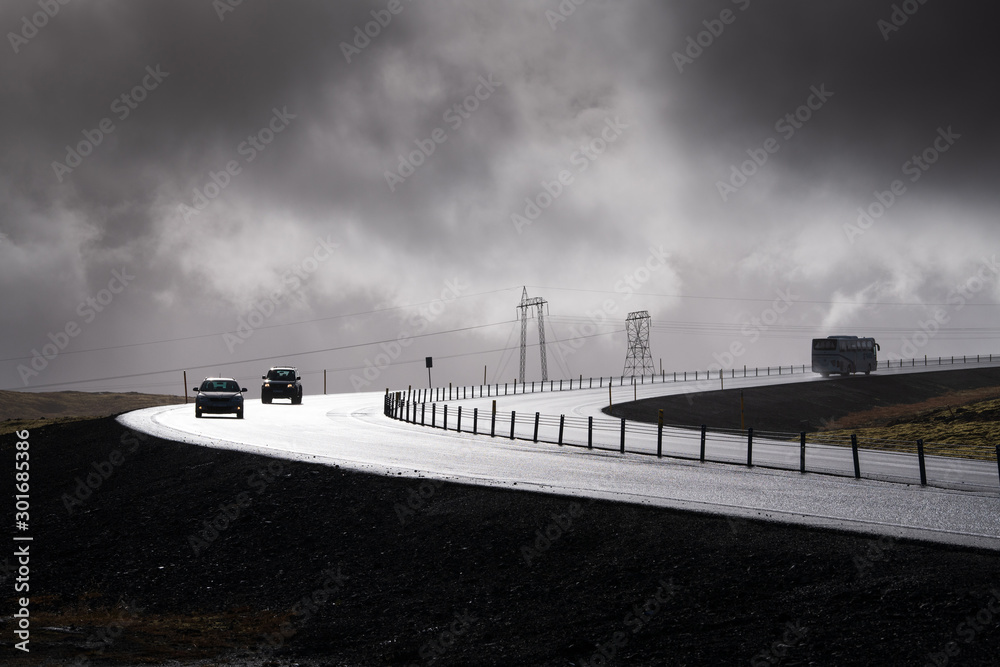 Fototapeta premium A car on road in rainy day, Iceland