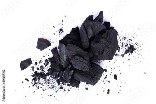 Photographie Pile of natural broken black activated charcoal granular and powder isolated on white background
