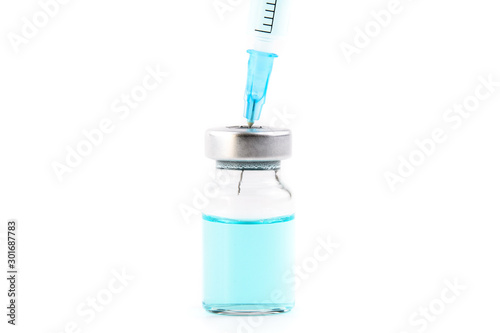 Close up of measles and flu vaccine vials for child vaccination, medicine and drug concept