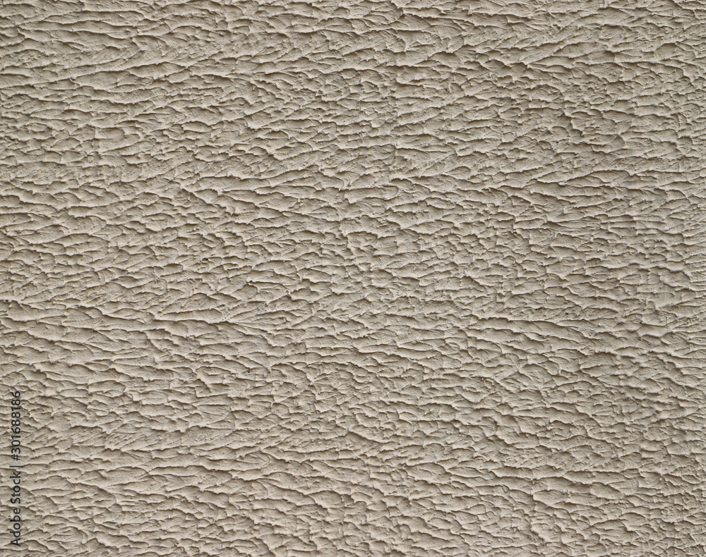 Texture of stucco used as an exterior coating on a building Texture of stucco used as an exterior coating on a building