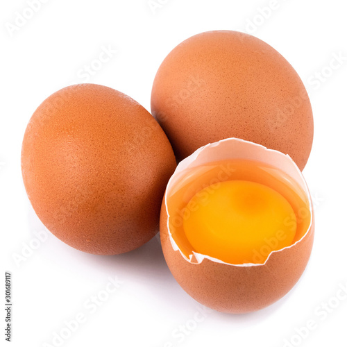Closeup of raw chicken eggs in egg box on brown wooden background, organic food from nature good for health