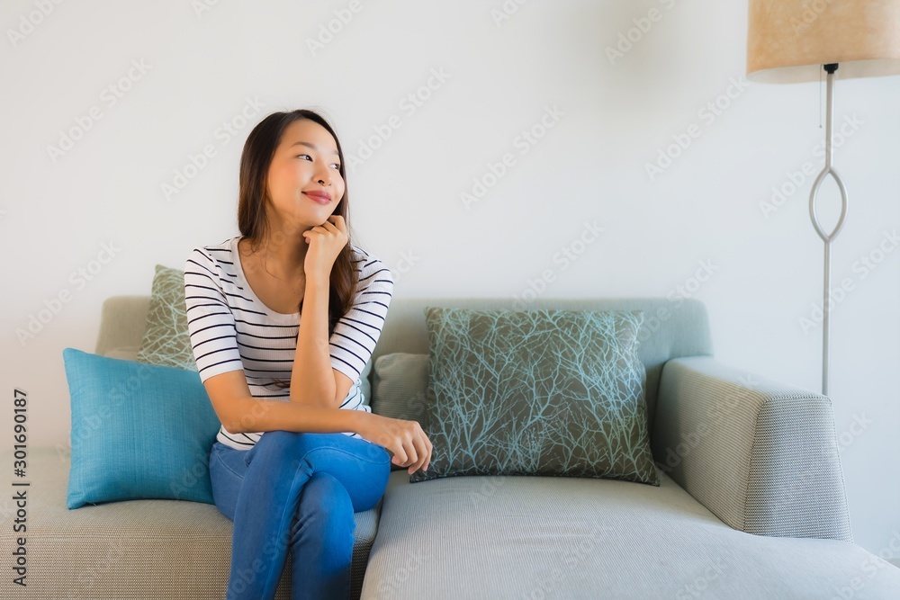 Portrait beautiful young asian woman smile happy on sofa Portrait beautiful young asian woman smile happy on sofa