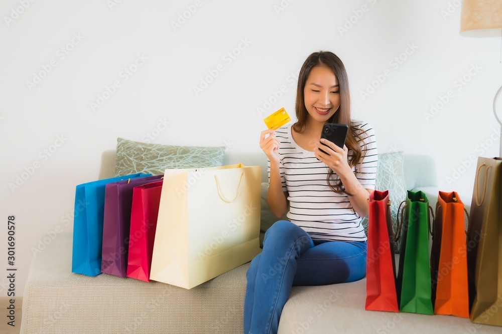 Portrait beautiful young asian women with credit card mobile phone or computer for shopping Portrait beautiful young asian women with credit card mobile phone or computer for shopping