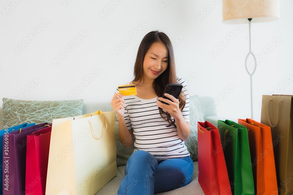 Portrait beautiful young asian women with credit card mobile phone or computer for shopping Portrait beautiful young asian women with credit card mobile phone or computer for shopping