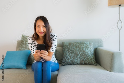 Portrait beautiful young asian woman using or talking mobile phone
