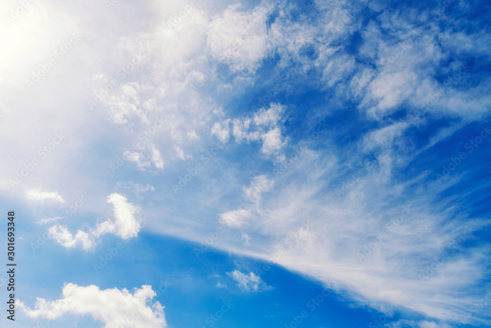 Fluffy white clouds flying on blue sky background