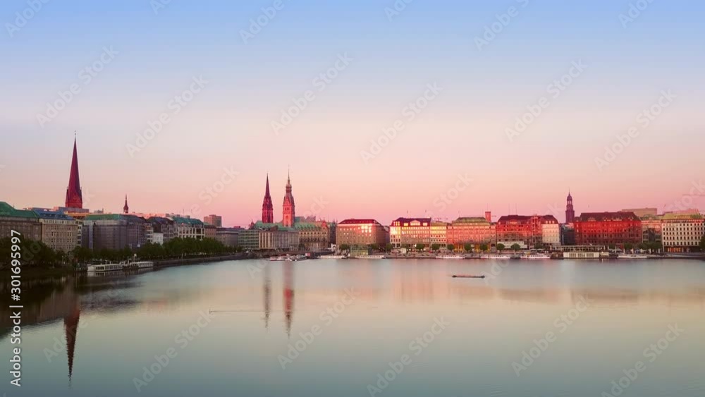aerial shot of hamburg old town flying up from alster lake at dawn aerial shot of hamburg old town flying up from alster lake at dawn