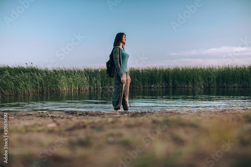 Girl on the lake in the evening