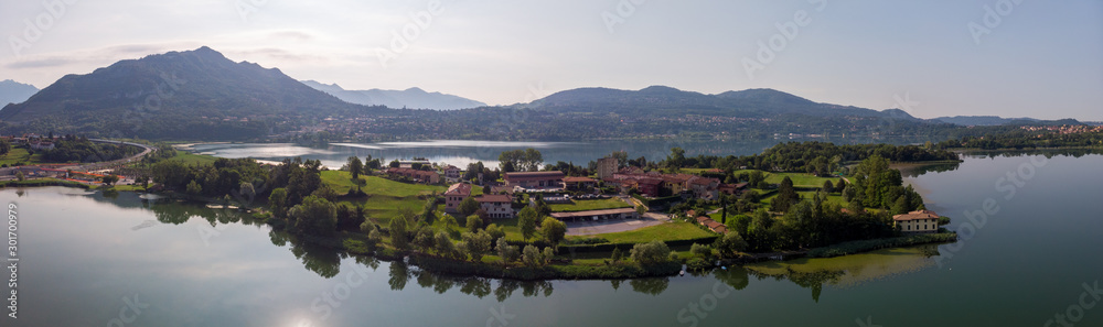 Lago di Pusiano panorama view of drone - lake and mountains on background