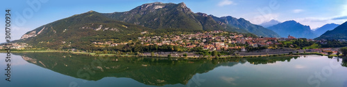 Lago di Pusiano panorama view of the drone - reflections in the lake. Mountain on background