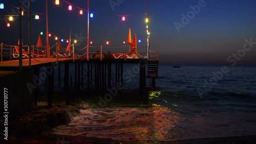 FAIRY LIGHTS ON MEDITERRANEAN PIER AT DUSK photo