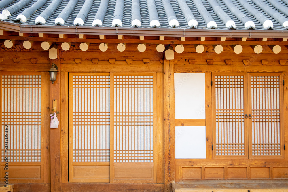 Bright wooden doors and windows of a traditional Korean home (hanok) in