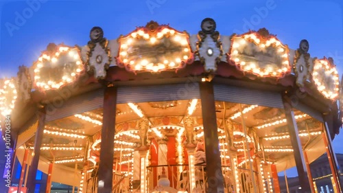 Old French traditional fairground vintage carouse in a holiday park photo