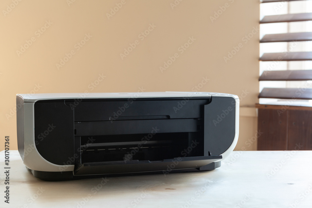 Fototapeta premium Close up of an office table with printer on it