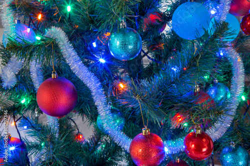 Christmas toys and a garland on the Christmas tree