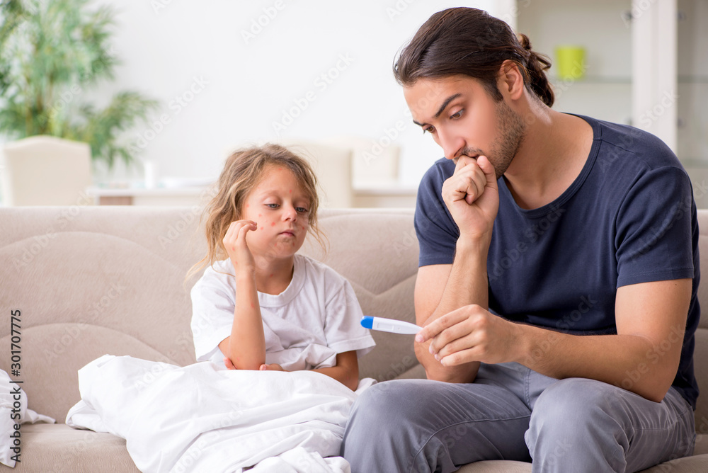 Father taking care of his ill daughter Father taking care of his ill daughter