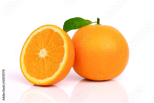 Closeup whole and half ripe fresh mandarin or tangerine orange fruit with green leaf isolated on white background with clipping path.