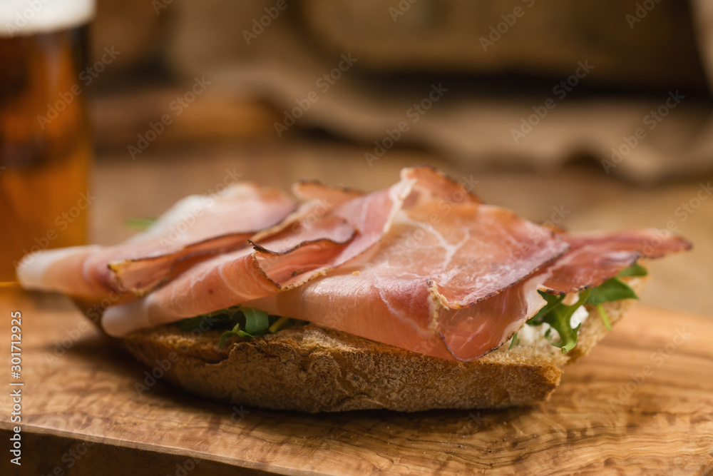 italian sandwich with speck and arugula