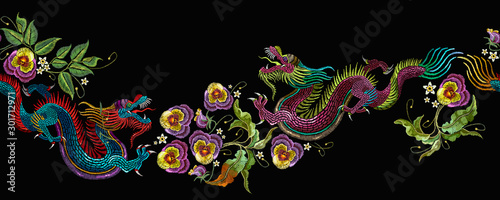 Embroidery asian dragons and beautiful flowers seamless pattern. Japan art. East style. Clothes, textile design template