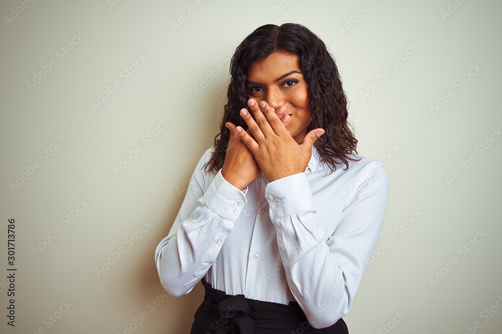 Beautiful transsexual transgender elegant businesswoman over isolated white background shocked covering mouth with hands for mistake. Secret concept. Beautiful transsexual transgender elegant businesswoman over isolated white background shocked covering mouth with hands for mistake. Secret concept.