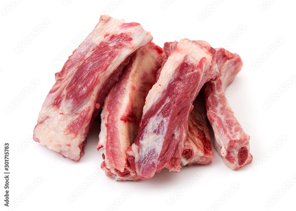 raw pork ribs yet to be cooked on a white background.