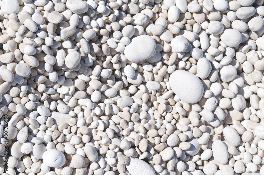 Full frame detail close-up of smooth white Mediterranean pebble beach background in Kefalonia, Greece Full frame detail close-up of smooth white Mediterranean pebble beach background in Kefalonia, Greece