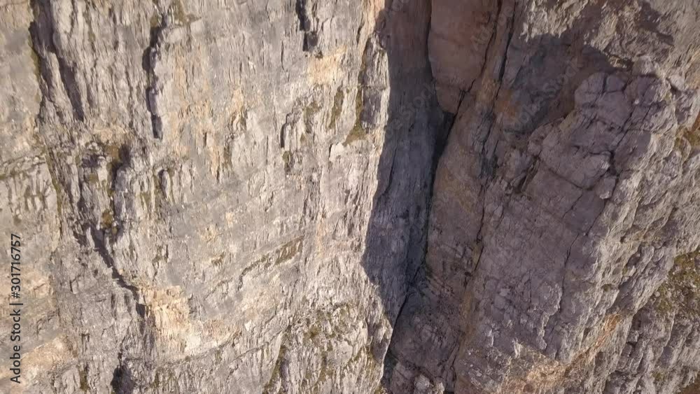 Very close drone fly and filming of the special and famous dolomite rocks in the morning light, Tofana area near Cortina D'Ampezzo., Italy. Very close drone fly and filming of the special and famous dolomite rocks in the morning light, Tofana area near Cortina D'Ampezzo., Italy.