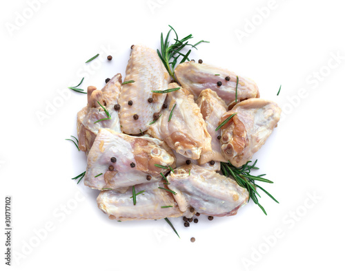 Raw chicken wings with garlic, pepperand rosemary isolated photo