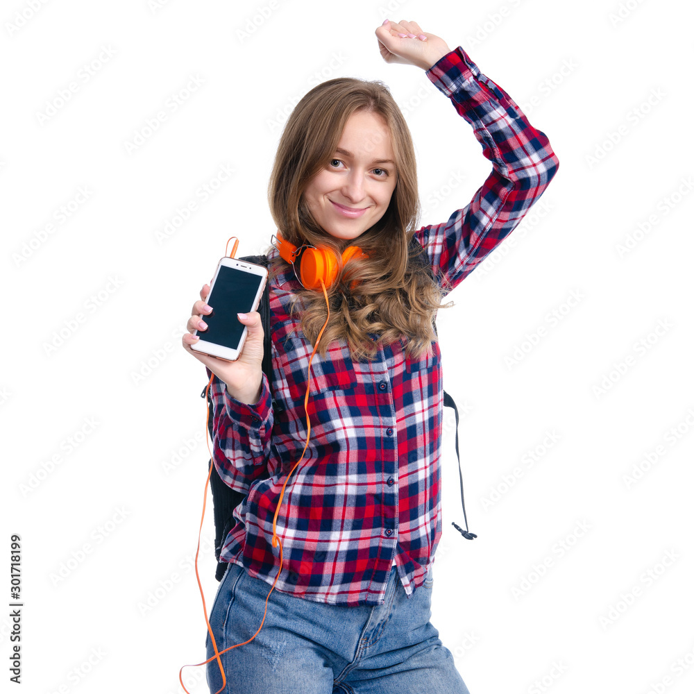 Portrait casual woman, student with backpack and headphones holding mobile phone in hand standing, smiling, dancing, happiness on white background isolation Portrait casual woman, student with backpack and headphones holding mobile phone in hand standing, smiling, dancing, happiness on white background isolation