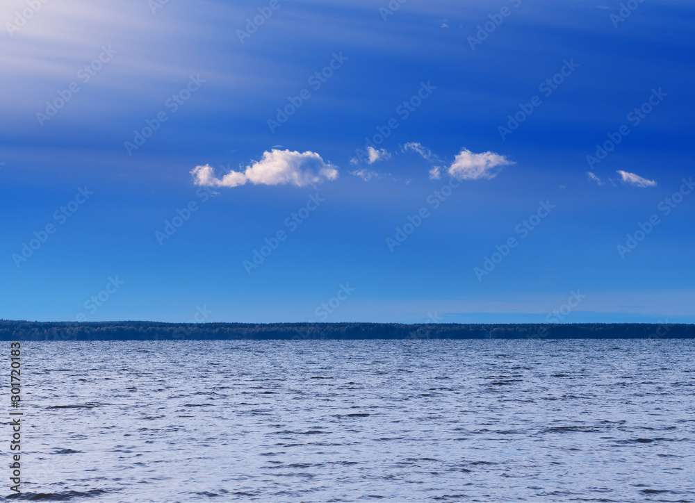 Blue sky with clouds above river horizon landscape background