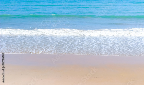 tropical beach clear water sea wave and white sand background