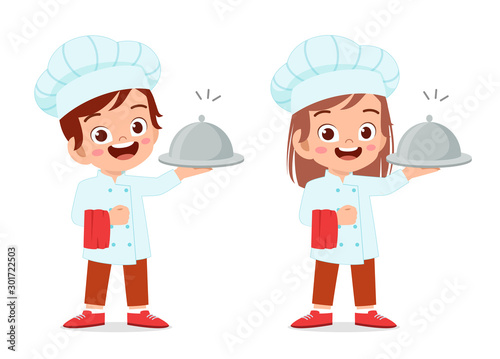 happy cute kid boy and girl in chef costume