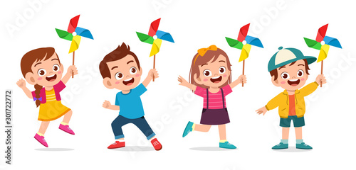 happy cute kid boy and girl holding toy