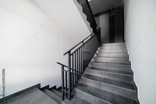 Stairs and handrails in design. Elements of metal on stairs