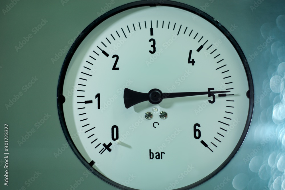 Gas pressure gauge on technical and machine background. Gas pressure gauge on technical and machine background.