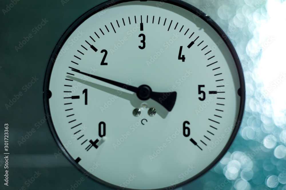 Gas pressure gauge on technical and machine background. Gas pressure gauge on technical and machine background.