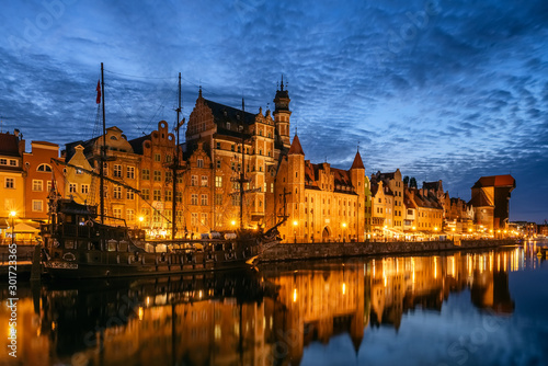 Panorama of the Gdansk old town and famous crane at night Gdansk