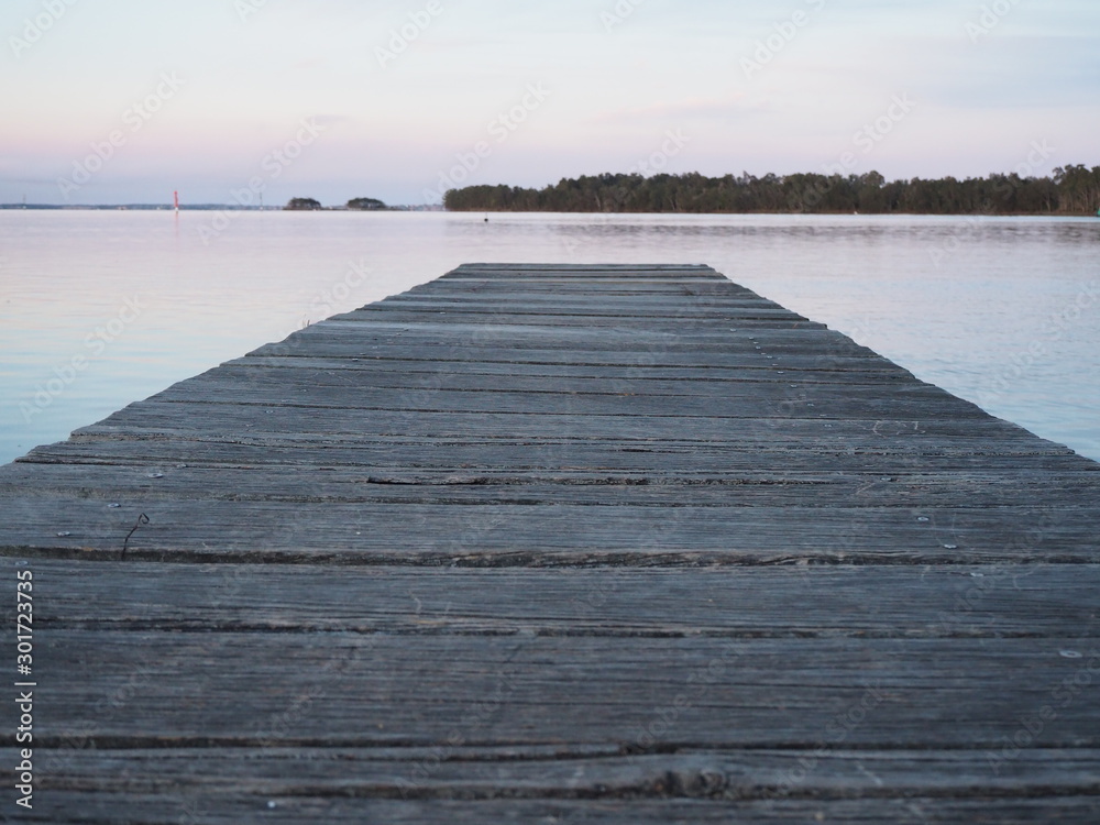 wooden jetty at sunset