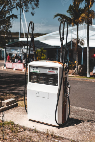 Laurieton Seafoods, Laurieton, NSW Australia - October 20th 2019: Vintage looking old fuel pump outside of Laurieton Seafoods on a sunny day. photo