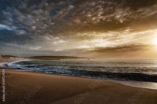 Evening time by Atlantic ocean in Nazare, Portugal.