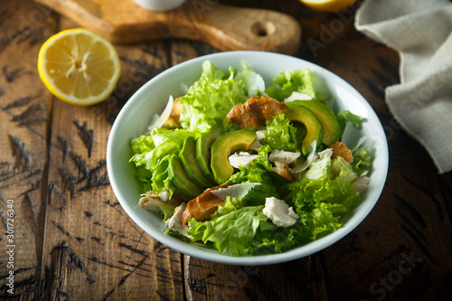 Homemade Caesar salad with chicken and avocado