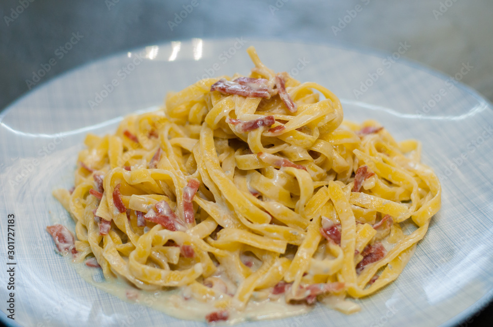 Tasty pasta with cheese and sausage. Traditional italian dish