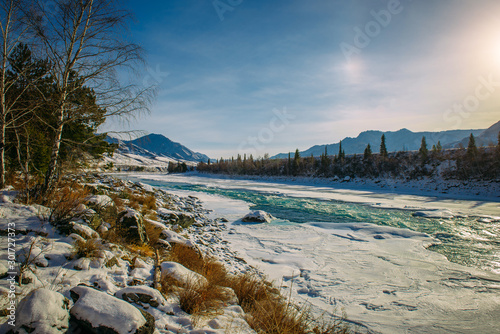 Billede på lærred Beautiful winter landscape, mountain river valley in fantastic sunlight