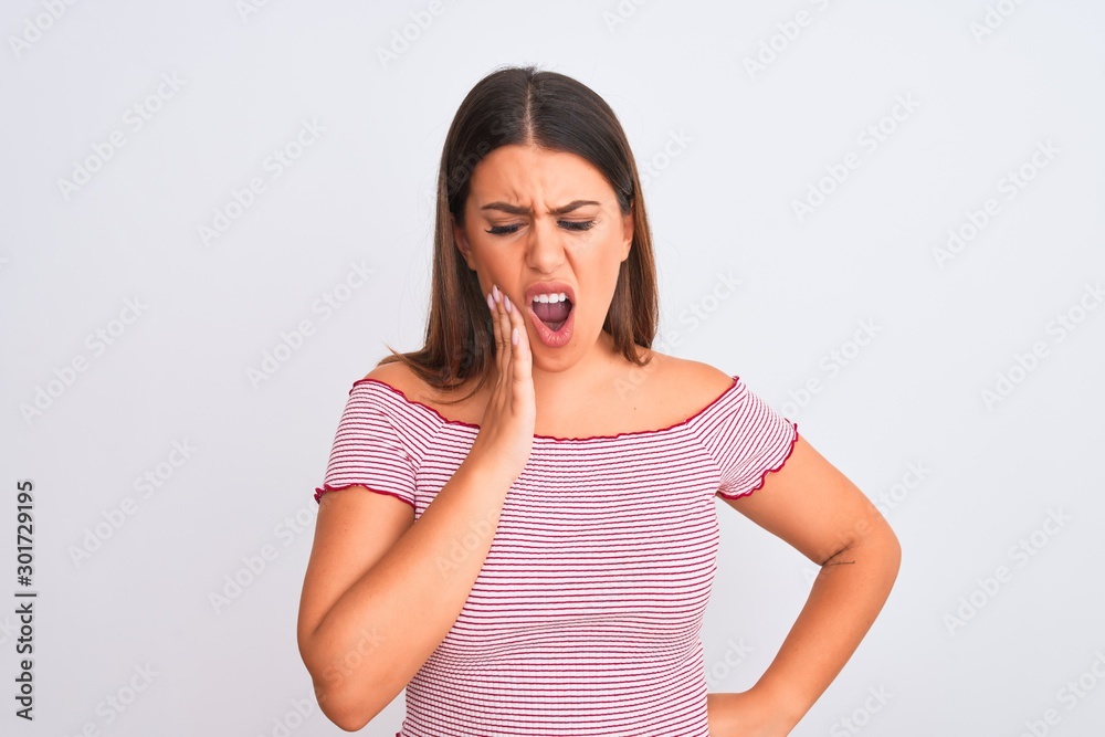 Portrait of beautiful young woman standing over isolated white background touching mouth with hand with painful expression because of toothache or dental illness on teeth. Dentist concept. Portrait of beautiful young woman standing over isolated white background touching mouth with hand with painful expression because of toothache or dental illness on teeth. Dentist concept.